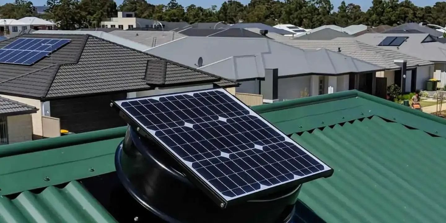 SolarKing solar roof ventilation fan installed on a green metal roof in Townsville, removing hot air and improving home comfort.