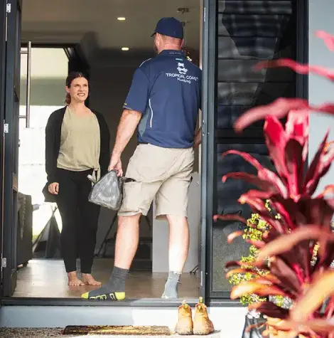 Tropical Coast Plumbing roofer arriving at a Townsville home, providing friendly and professional roof plumbing services with care.