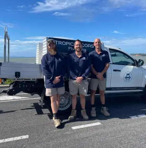 Townsville gas plumbers standing by service vehicle, delivering reliable gas maintenance and plumbing services across Queensland.