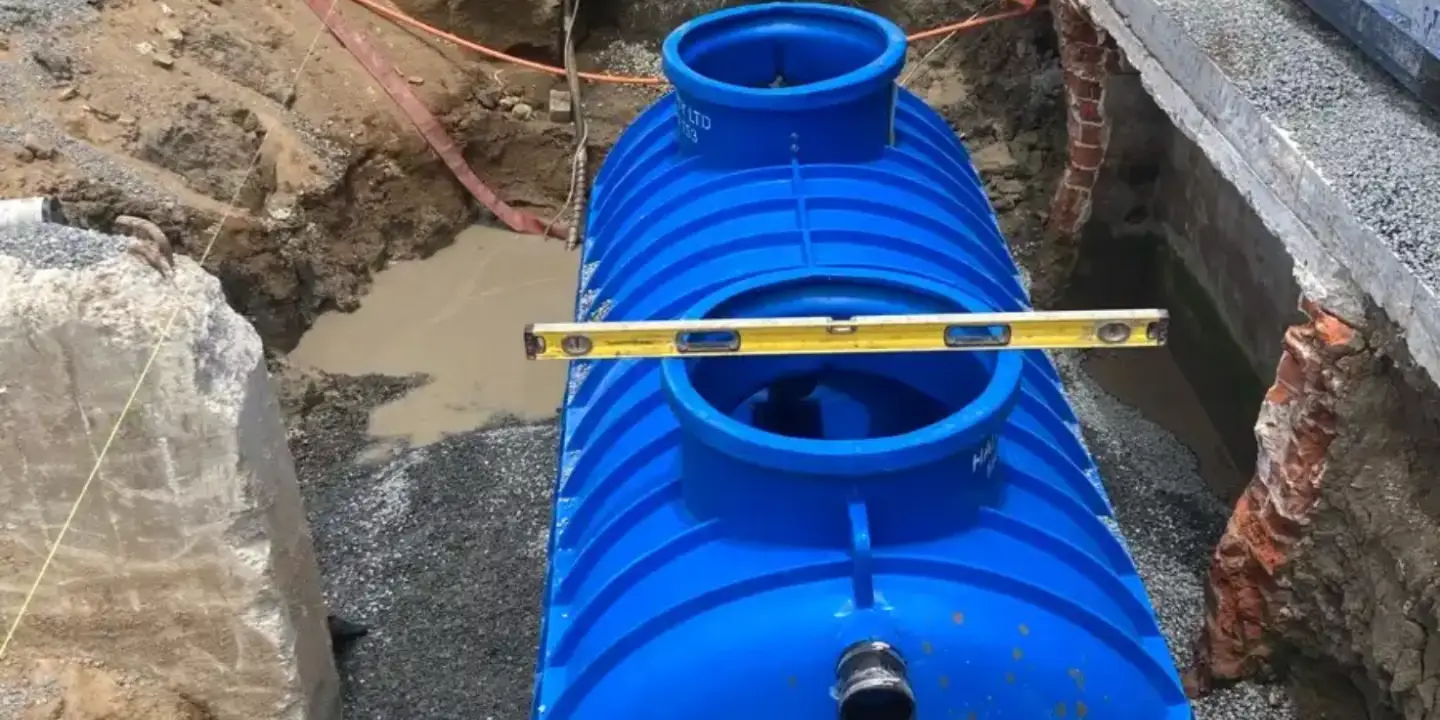 Townsville plumber repairing sink drainage connected to a grease trap system, preventing leaks, blockages, and sewage issues.