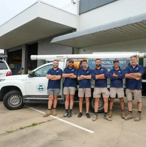 Tropical Coast Plumbing team of licensed Townsville plumbers standing outside headquarters, specialists in commercial plumbing services and maintenance.