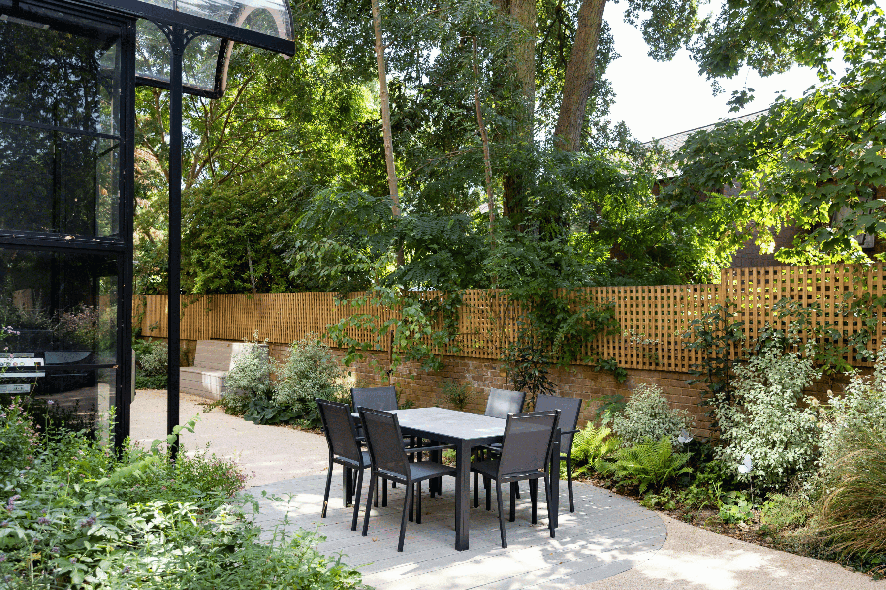 The Wellbeing Garden. In this shot you can see the garden's lift, seating area and the St John's butterflies amongst the plants.