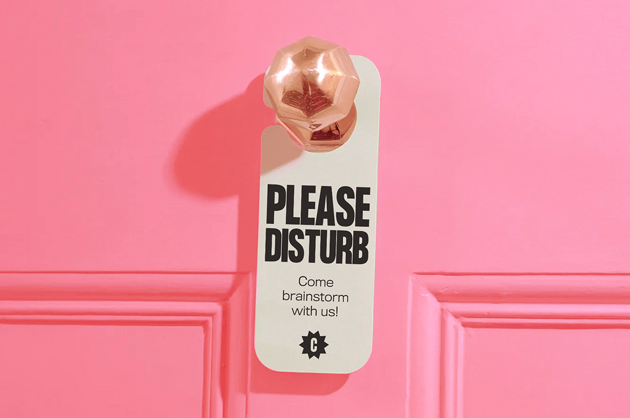 Mockup of custom hotel "please disturb" sign to invite clients to join us during our brainstorming process.