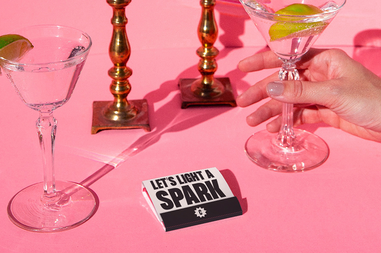Mockup of a custom matchbook inviting clients to light a spark with us.