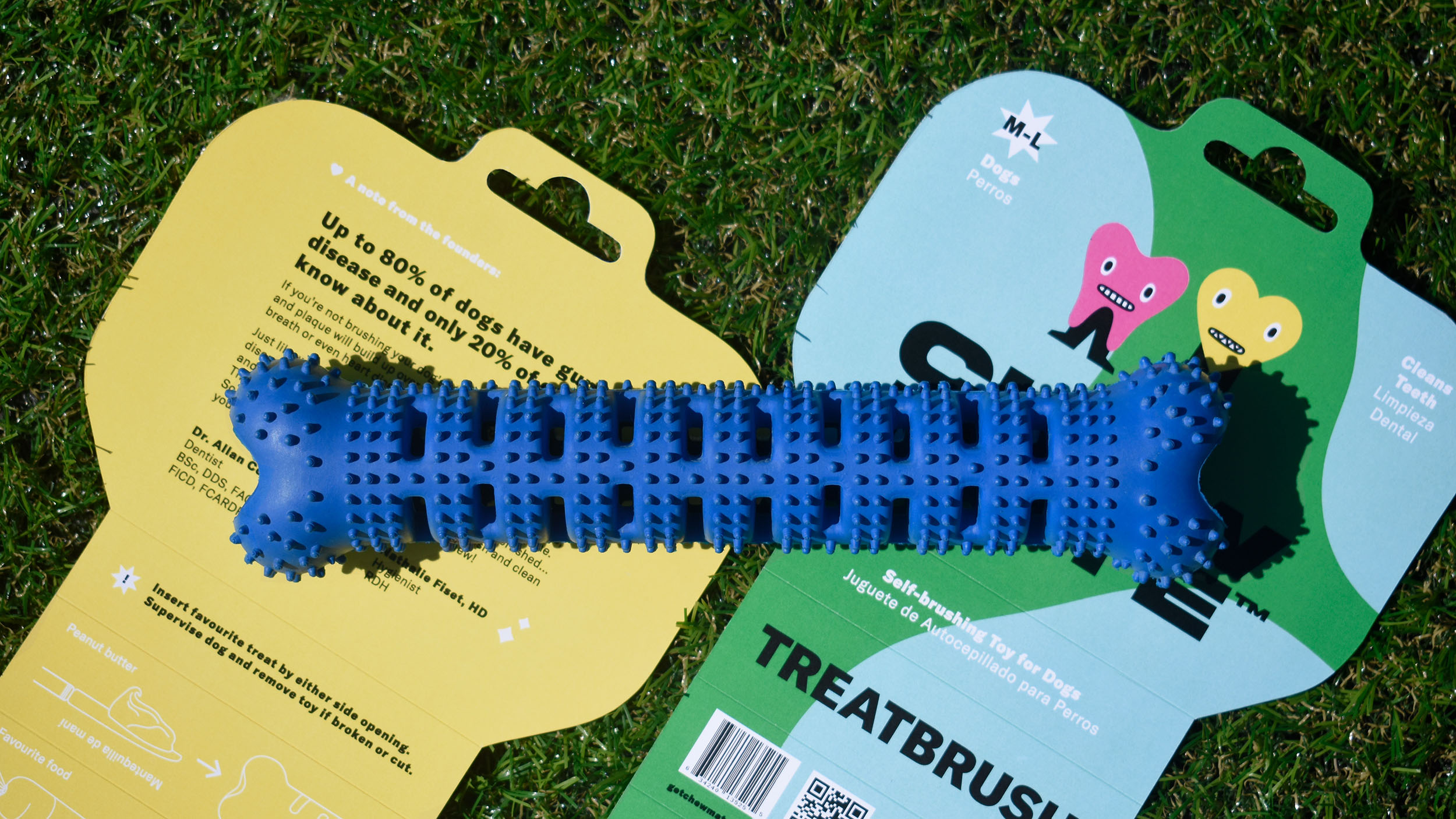 Photograph of inside and outside of the Treatbrush™ packaging with the product placed on top
