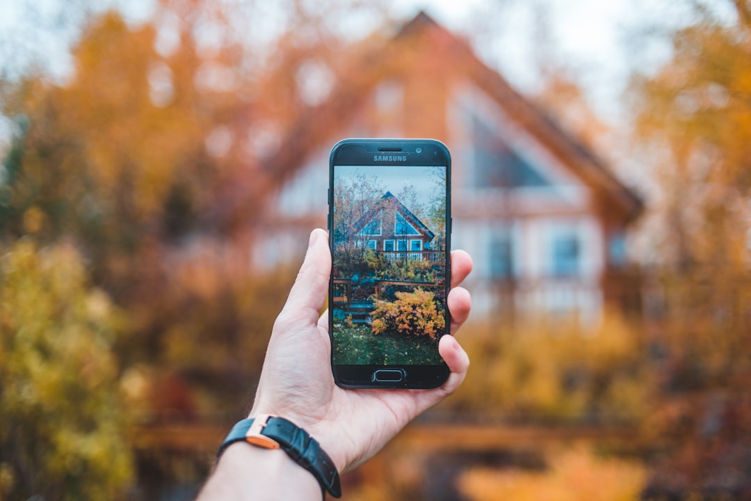 Homeowner using a smartphone app to document personal property for insurance inventory purposes - Home insurance coverage limits Homeowner using a smartphone app to document personal property for insurance inventory purposes - Home insurance coverage limits
