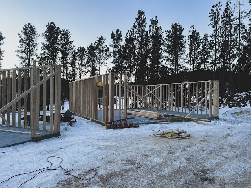 Maine construction site covered in snow with winterization measures in place - Builders Insurance Maine