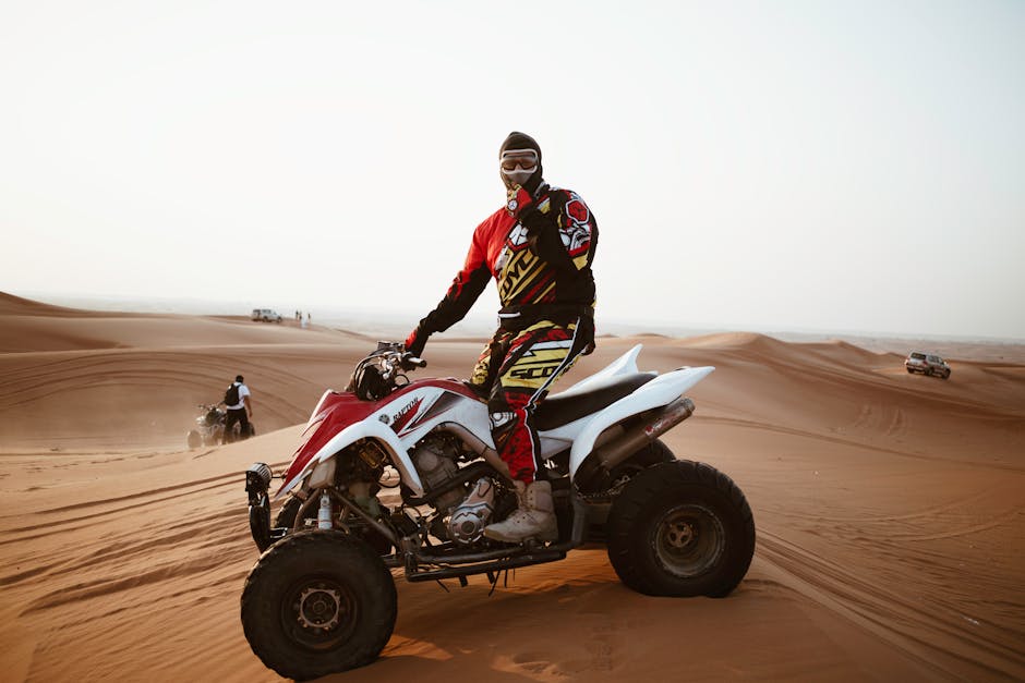 ATV rider wearing proper safety gear including helmet - ATV insurance Maine