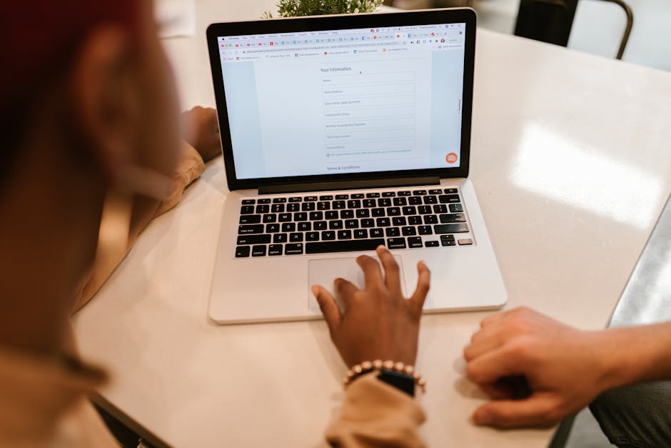 person on laptop with motorcycle insurance quote form on screen - motorcycle insurance quote person on laptop with motorcycle insurance quote form on screen - motorcycle insurance quote