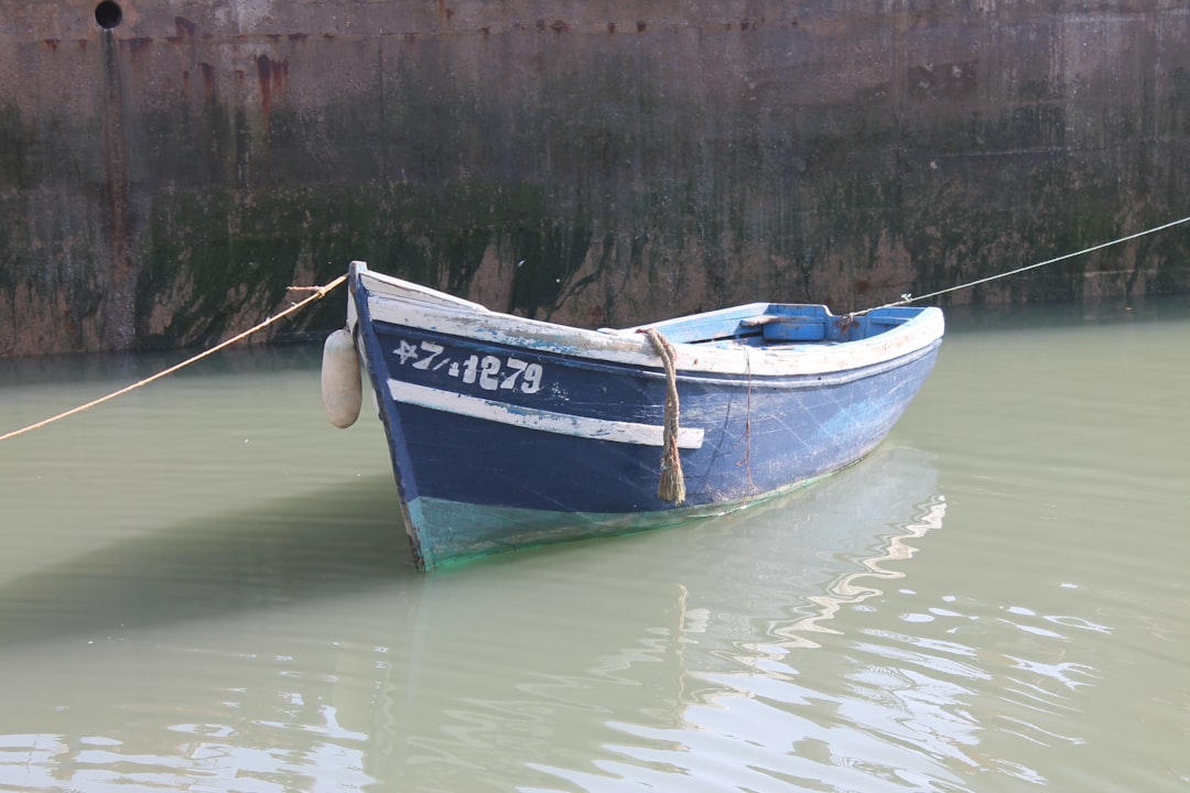 boat tied to a dock - Boat insurance Maine