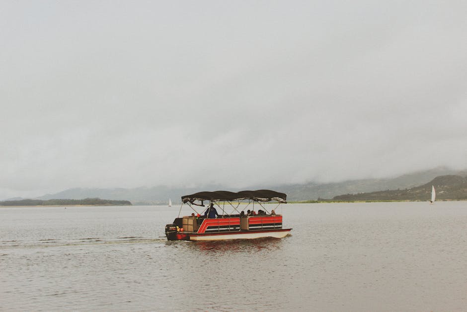pontoon boat on a Maine lake - Boat insurance Maine
