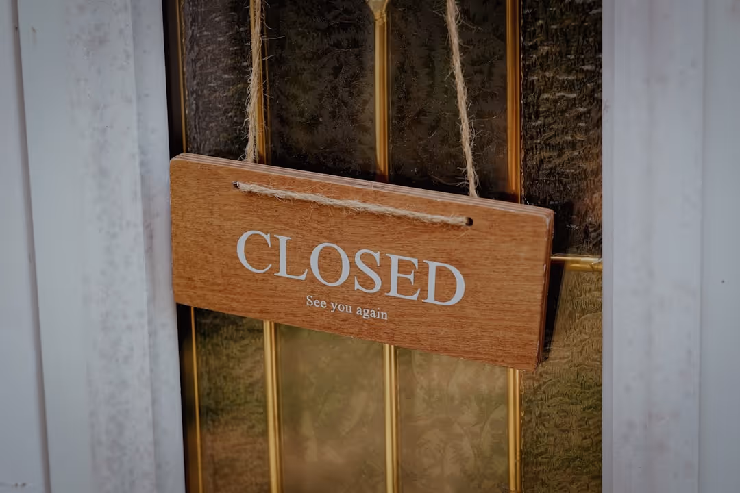 Permanently Closed sign on a business door - Business crime insurance cost