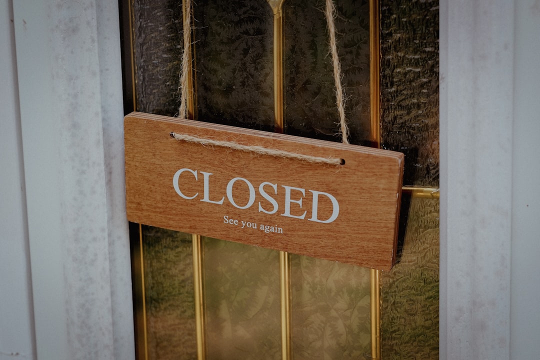 Permanently Closed sign on a business door - Business crime insurance cost
