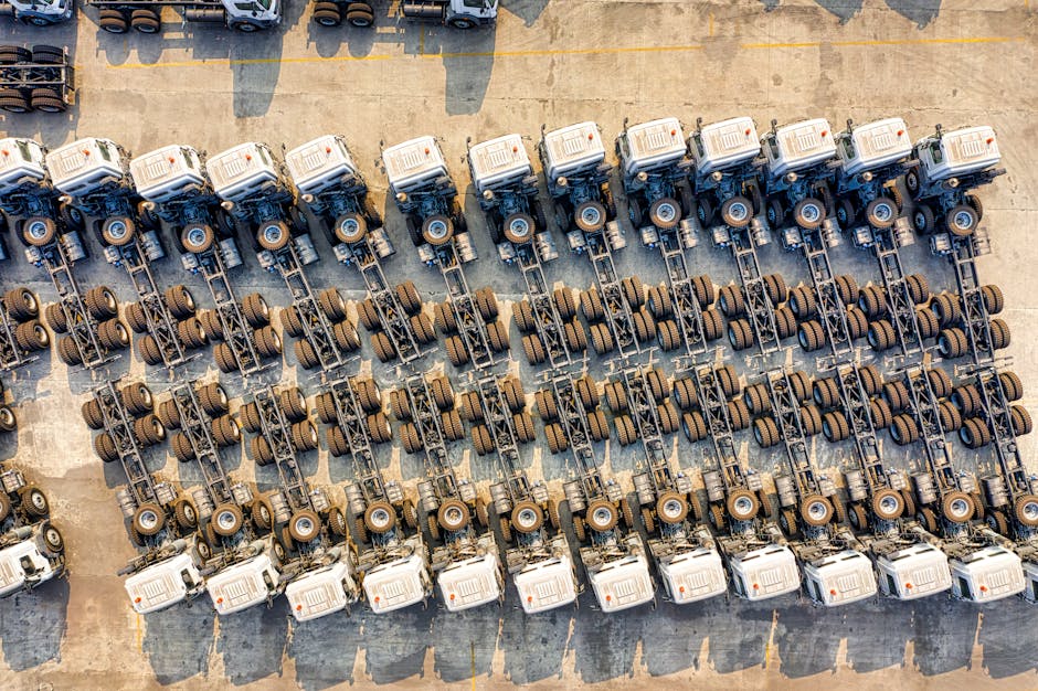 commercial vehicles lined up in rows aerial view - Business auto insurance providers