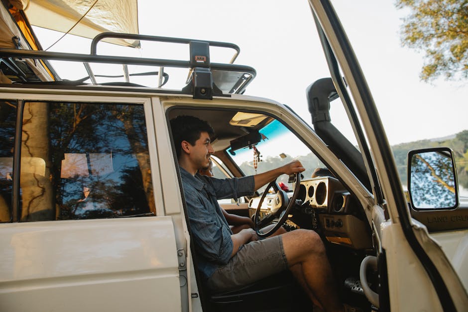 young man sitting in car