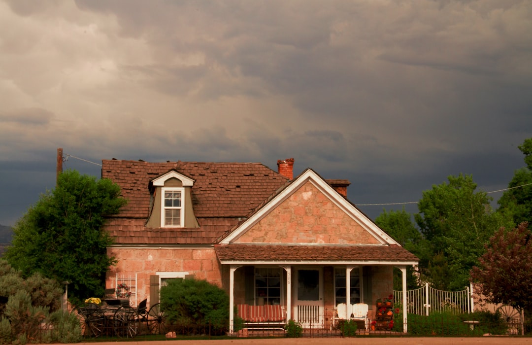 maine home with dark clouds overhead