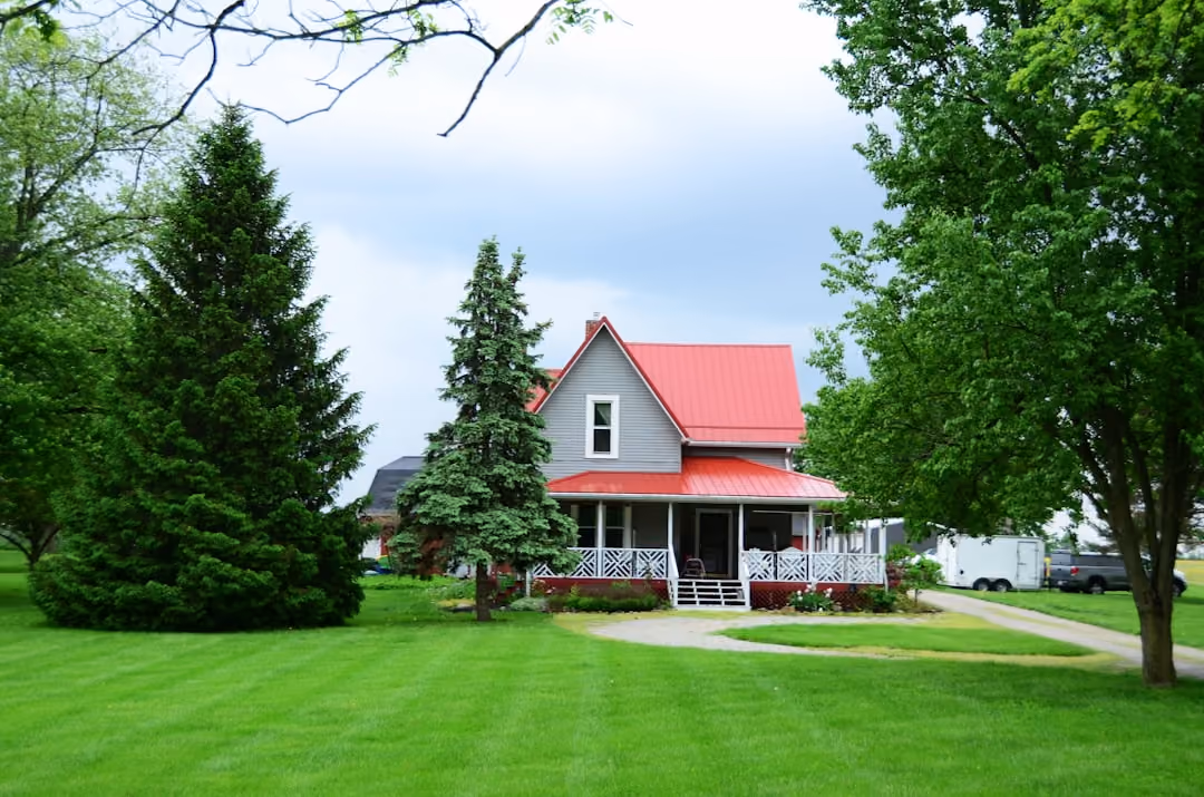 home with metal roof in maine - comprehensive home insurance concept