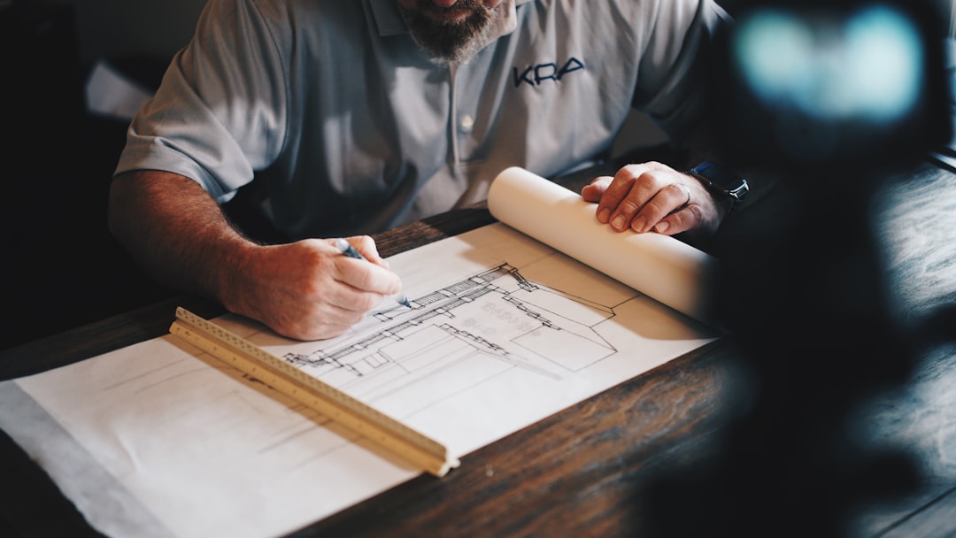 Contractor reviewing blueprints for a Wells renovation - builders insurance for renovations Contractor reviewing blueprints for a Wells renovation - builders insurance for renovations