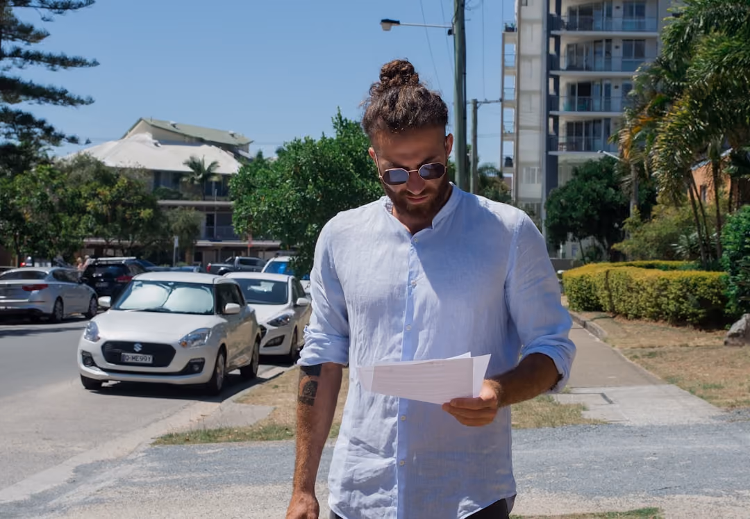 A driver reviewing insurance policy documents in Wells, Maine