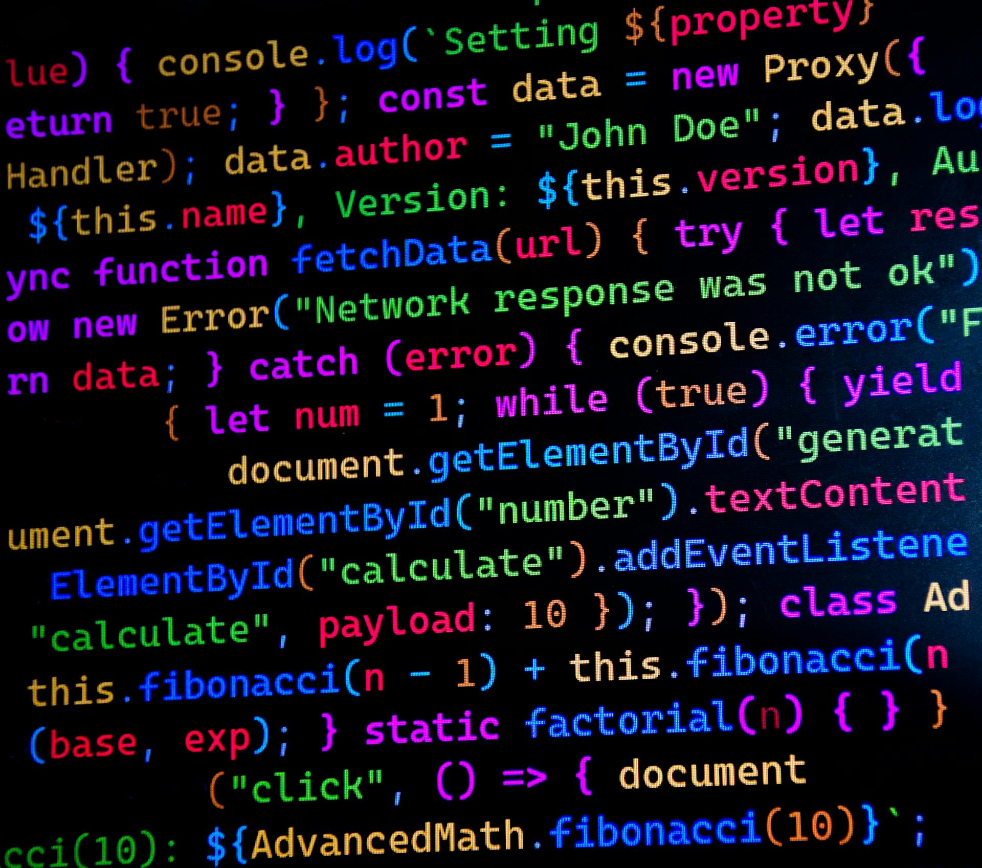 Bildschirm mit buntem JavaScript-Code als Sinnbild für JSON-LD Schema Markup und strukturierte Daten