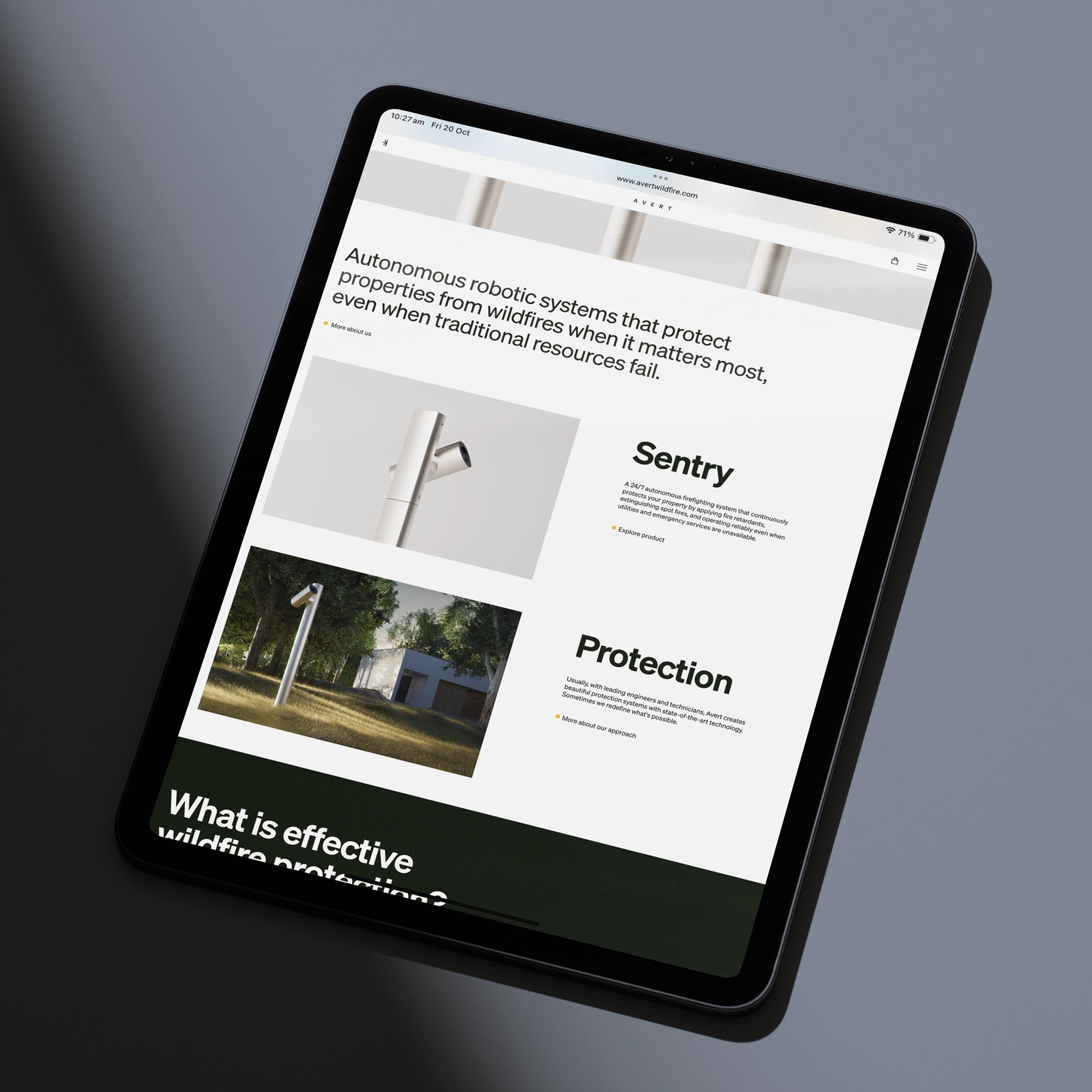 Tablet displaying Avert's website for autonomous wildfire protection robotic systems with product images and descriptions labeled 'Sentry' and 'Protection'.