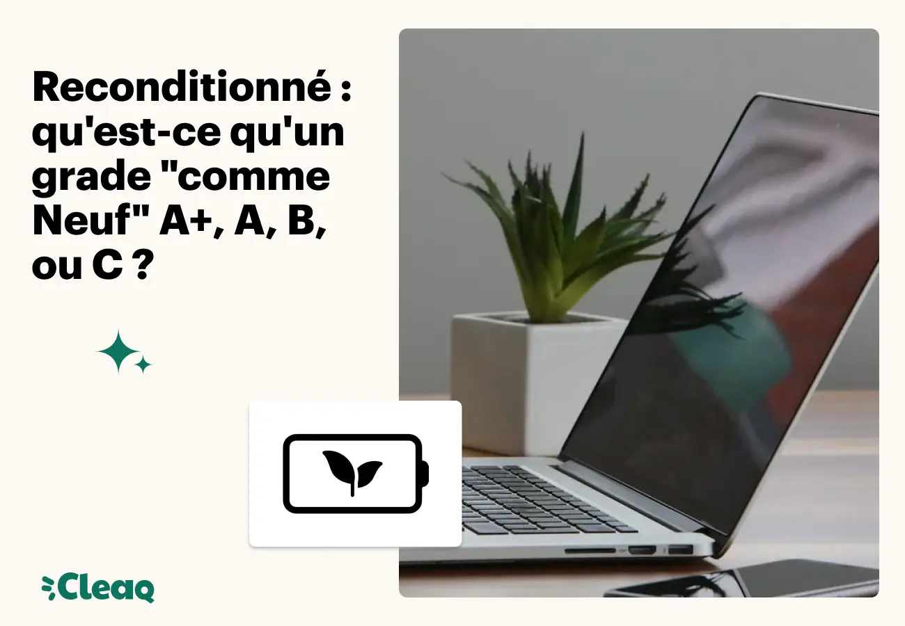 Ordinateur portable reconditionné ouvert à côté d'une plante
