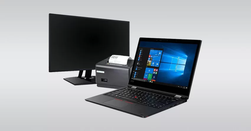 Écran, unité centrale et ordinateur portable sous Windows sur fond gris