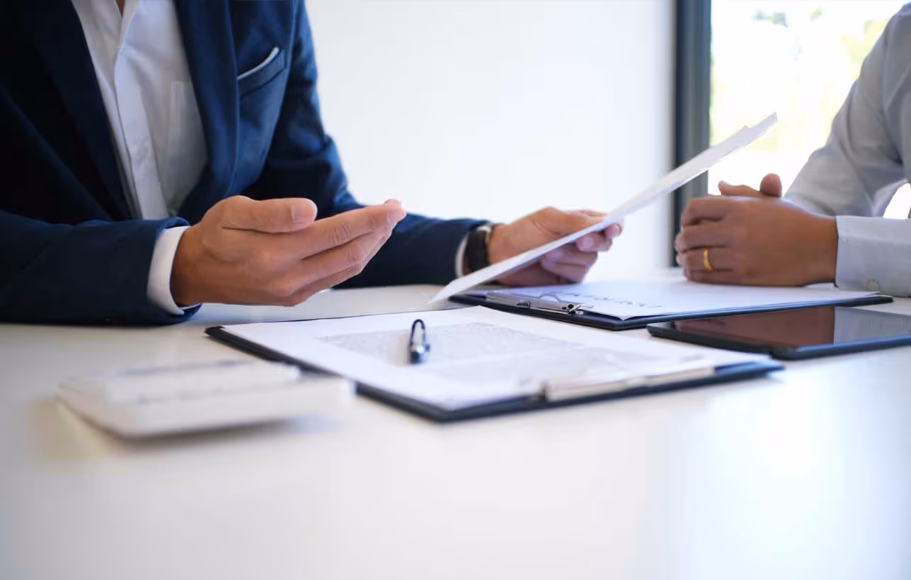 focus on hands at a business meeting table