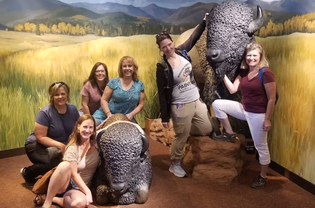 caption first team outing - standing in front of bison at musueum