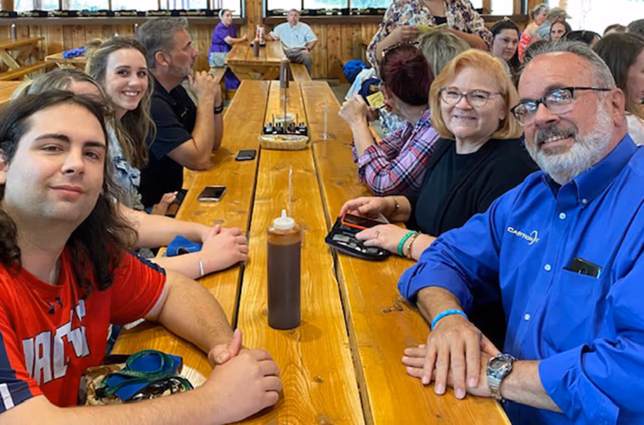 caption first team outing - dinner at long table