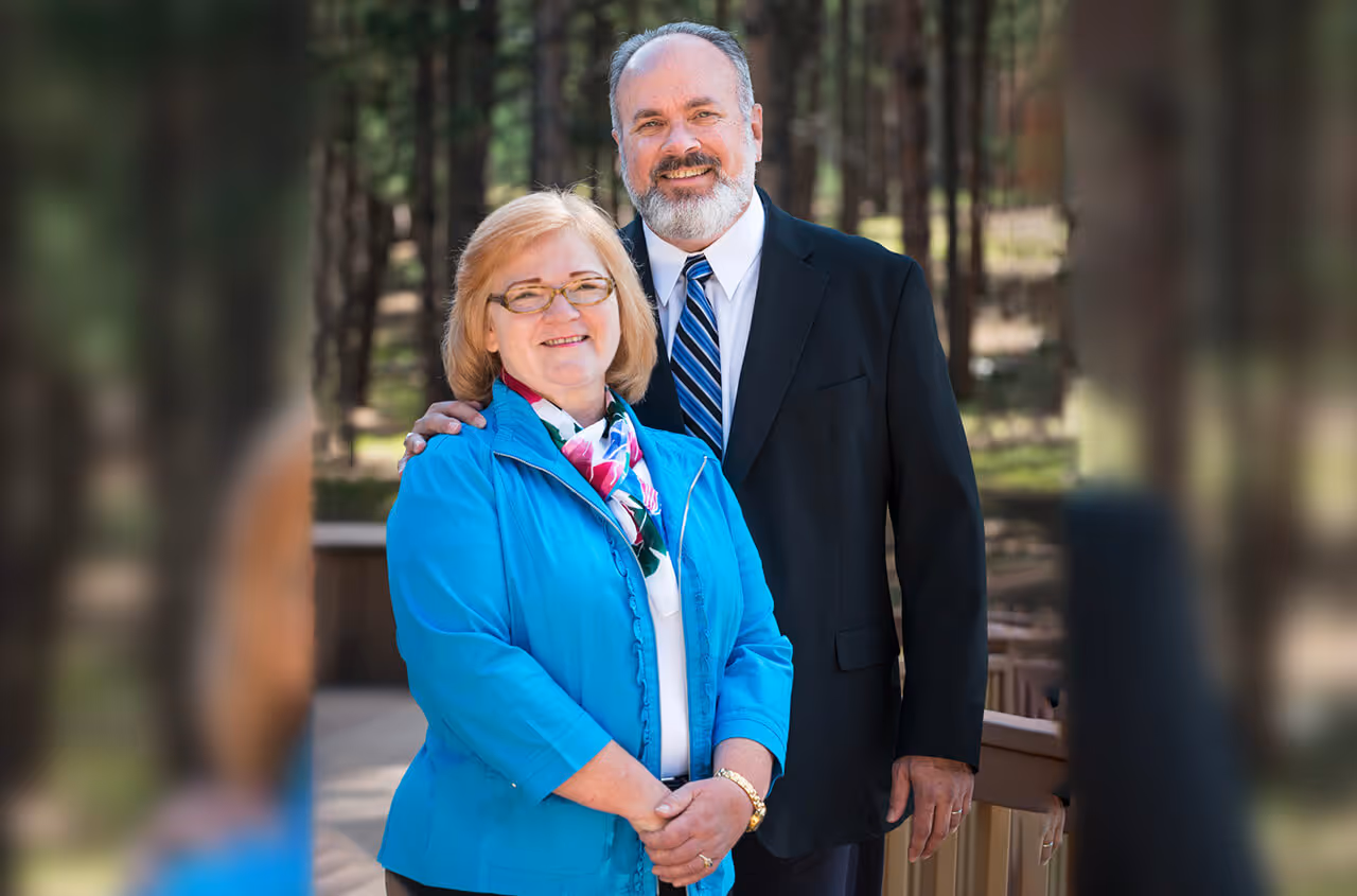 roy and pat graves standing together outside