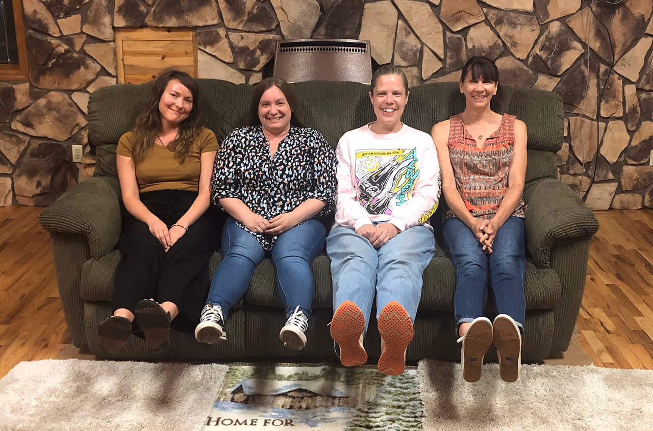 caption first team outing - sitting on couch