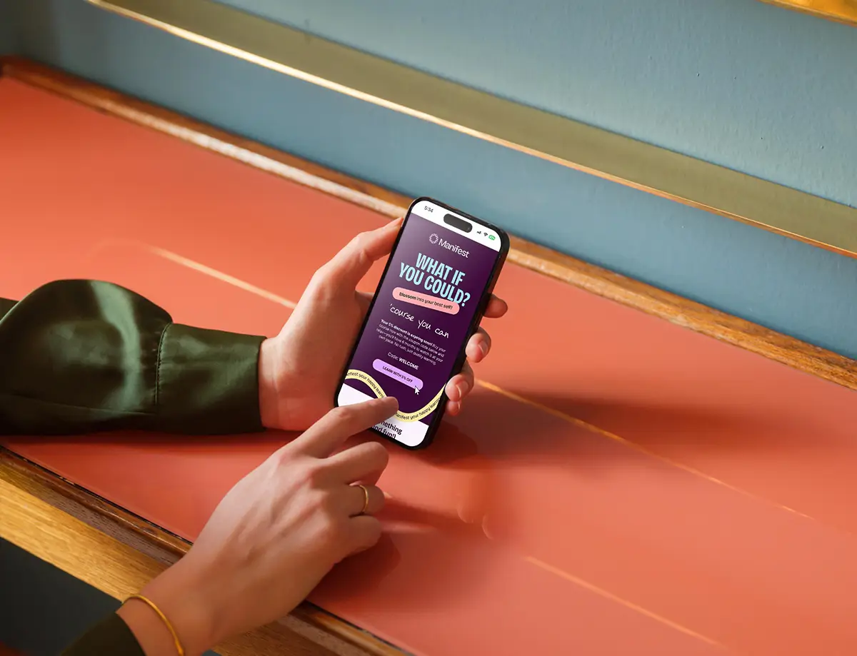 Female looking at an email design on iPhone