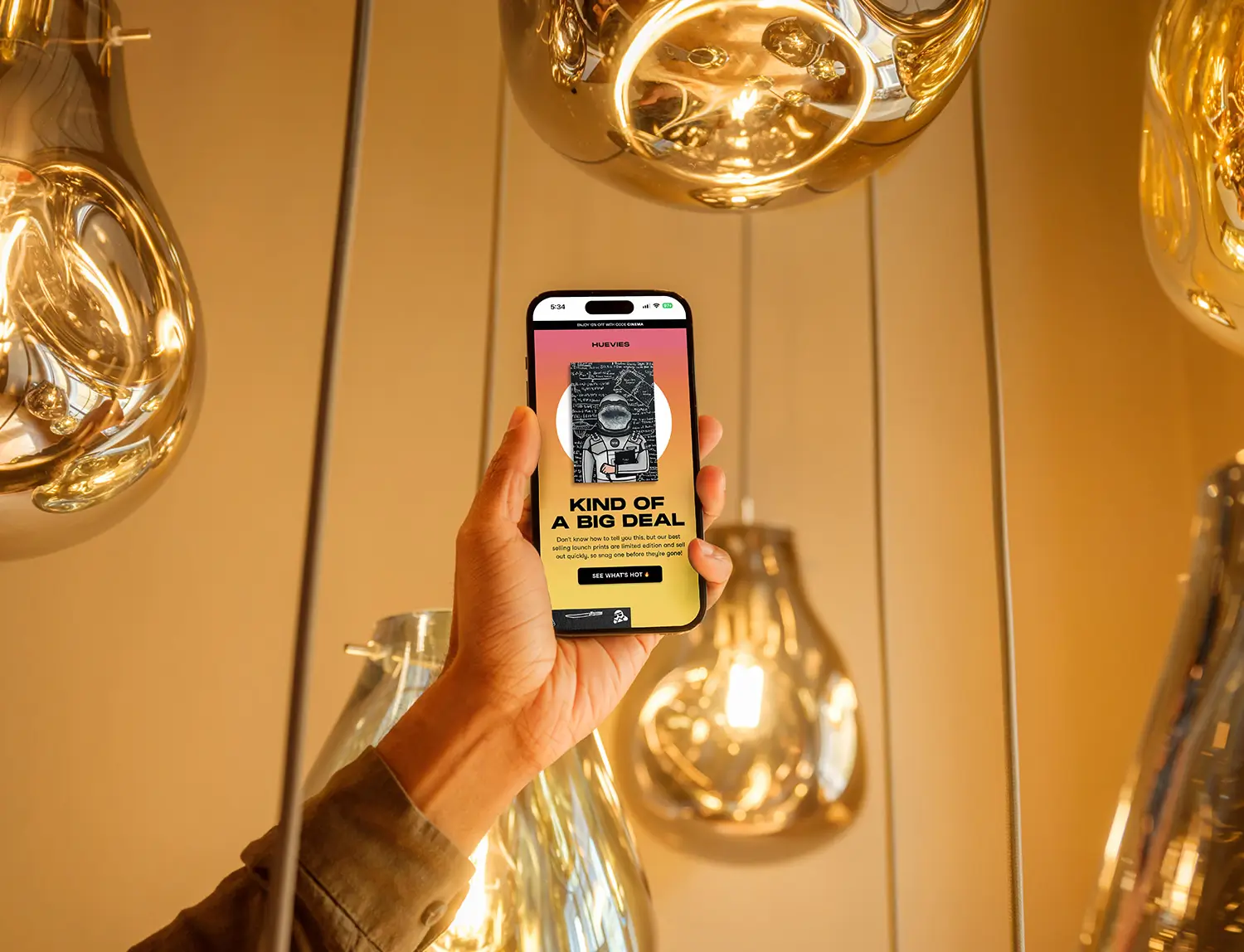 Female holding iPhone with an email design example