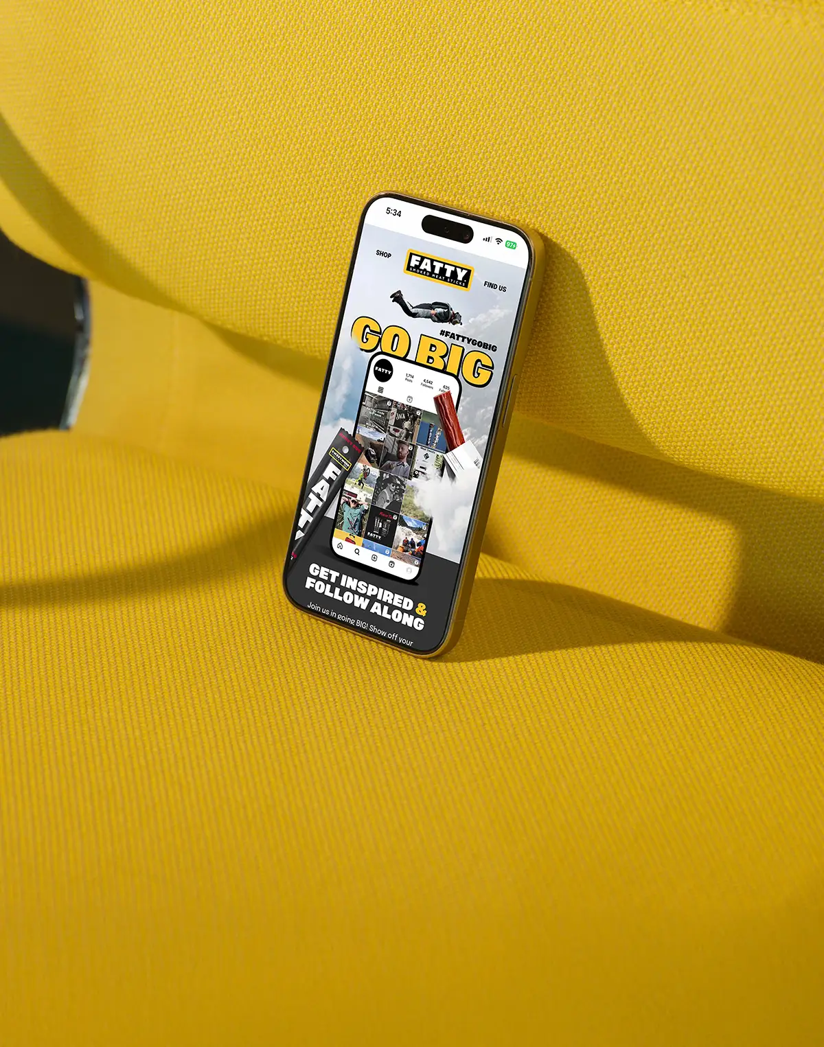 Email design example on an iPhone displayed on a yellow couch