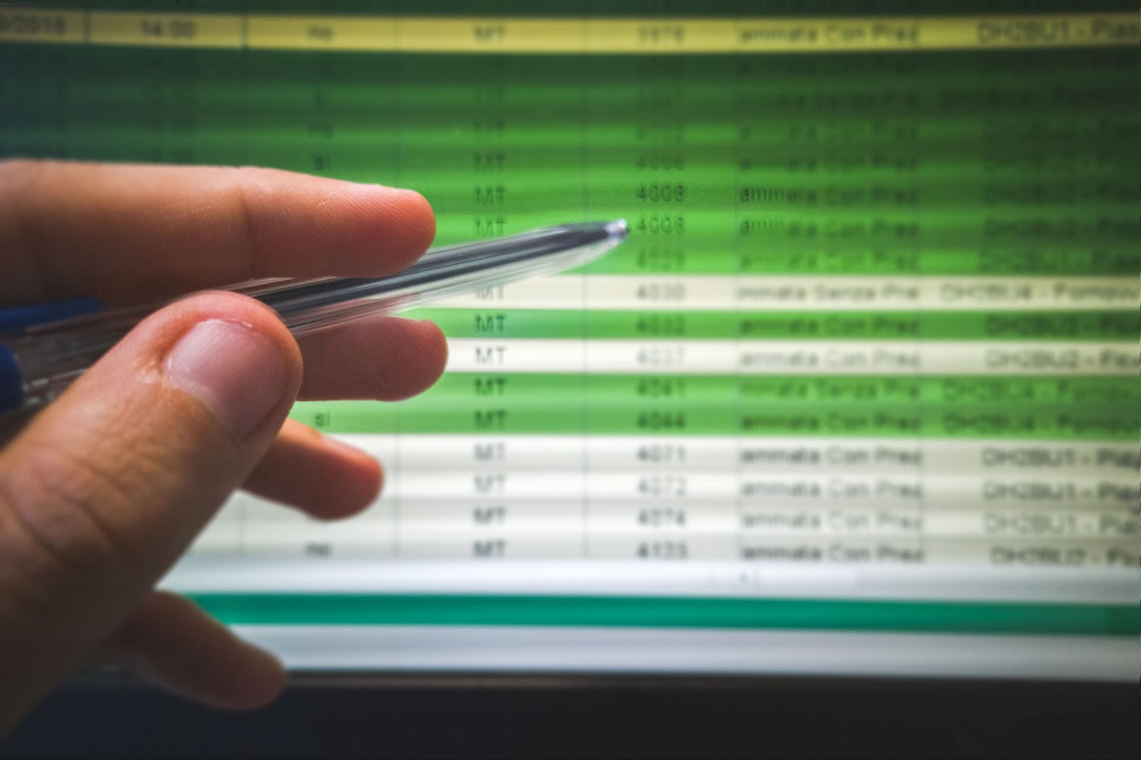 Pen pointing to a screen
