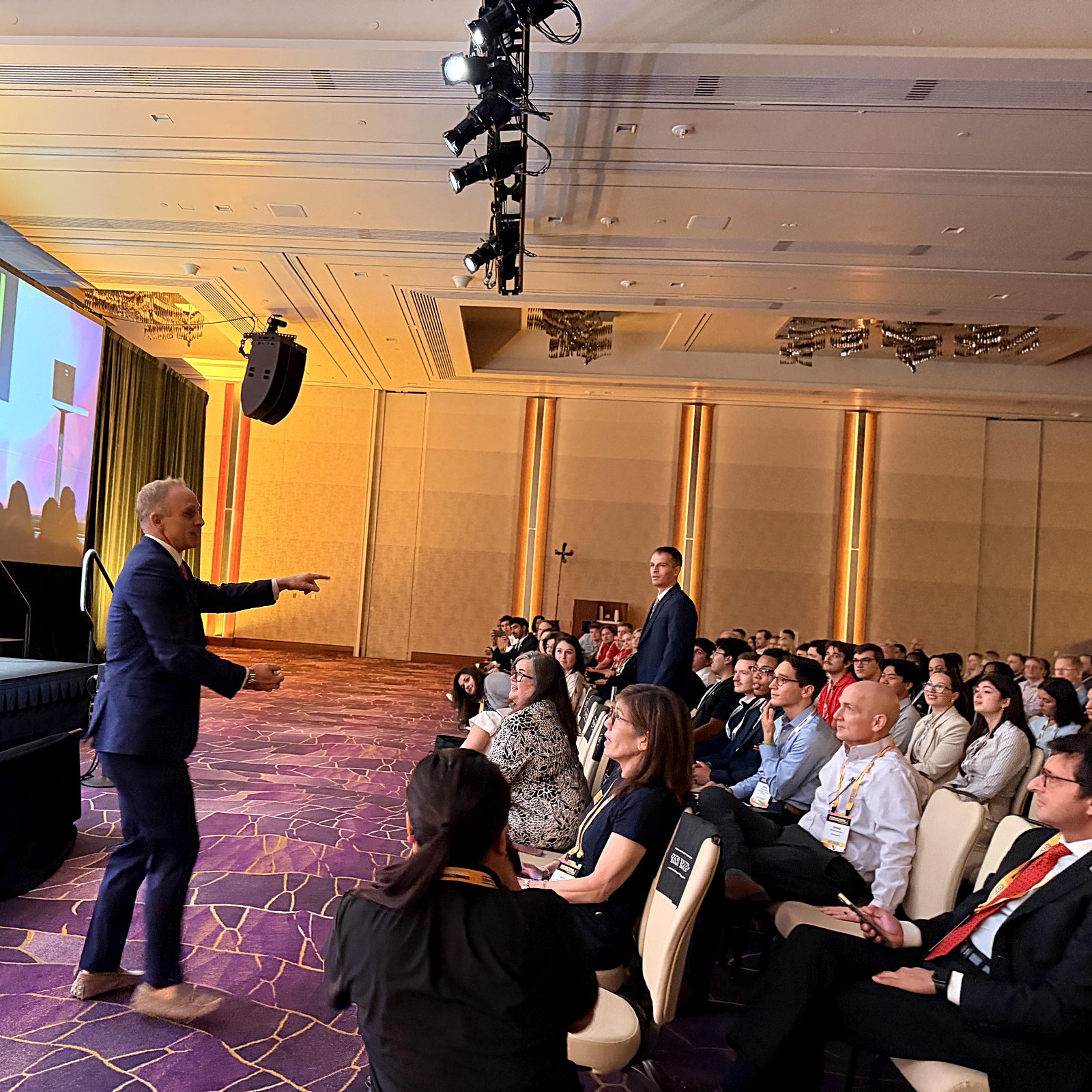 Theron Schaub performing on stage for a large audience