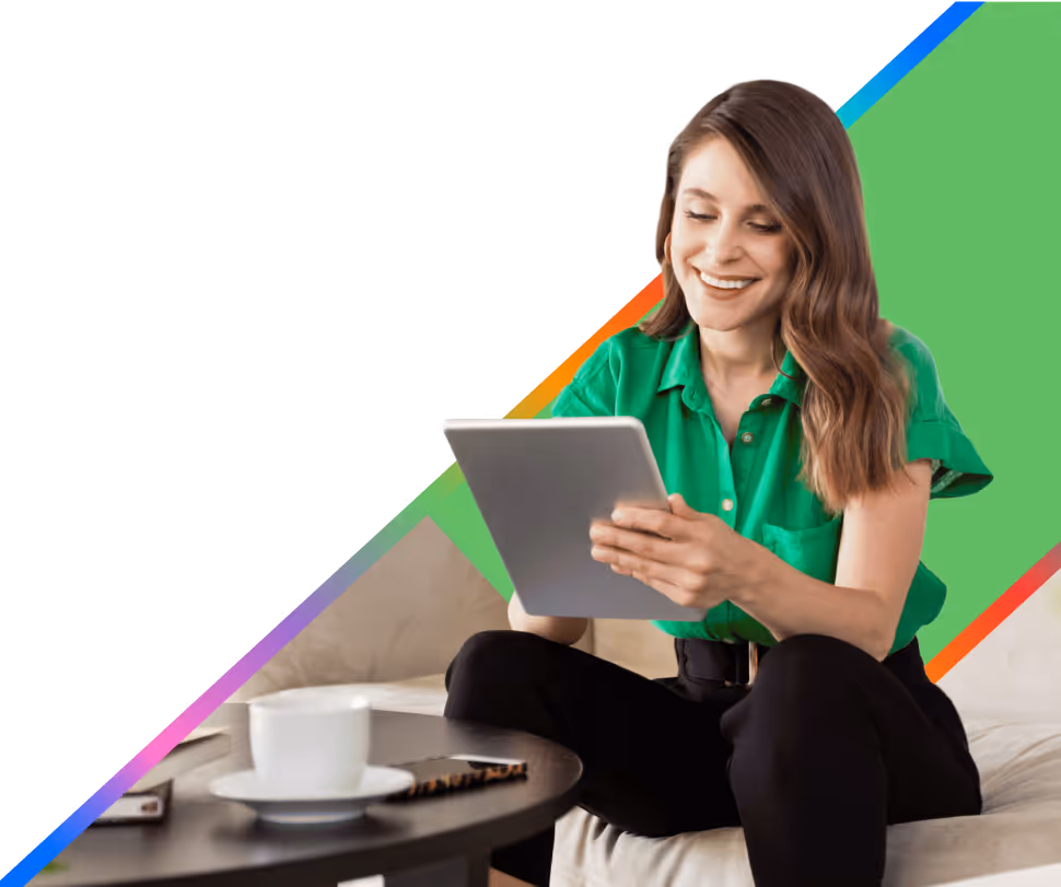 A women holding a digital tablet and smiling
