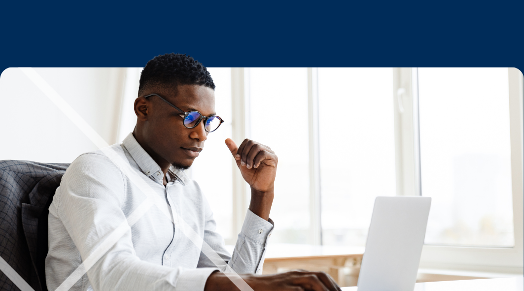 Man sitting at a laptop First Technology Cyber Security Solutions Workshops