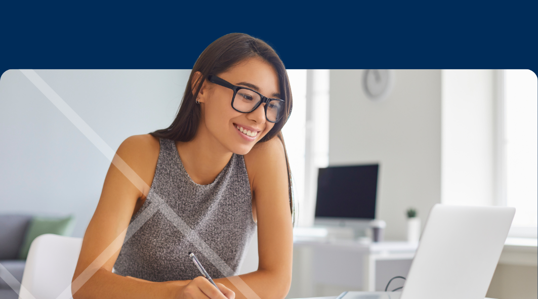 Woman sitting at a laptop First Technology Cyber Security Solutions Workshops
