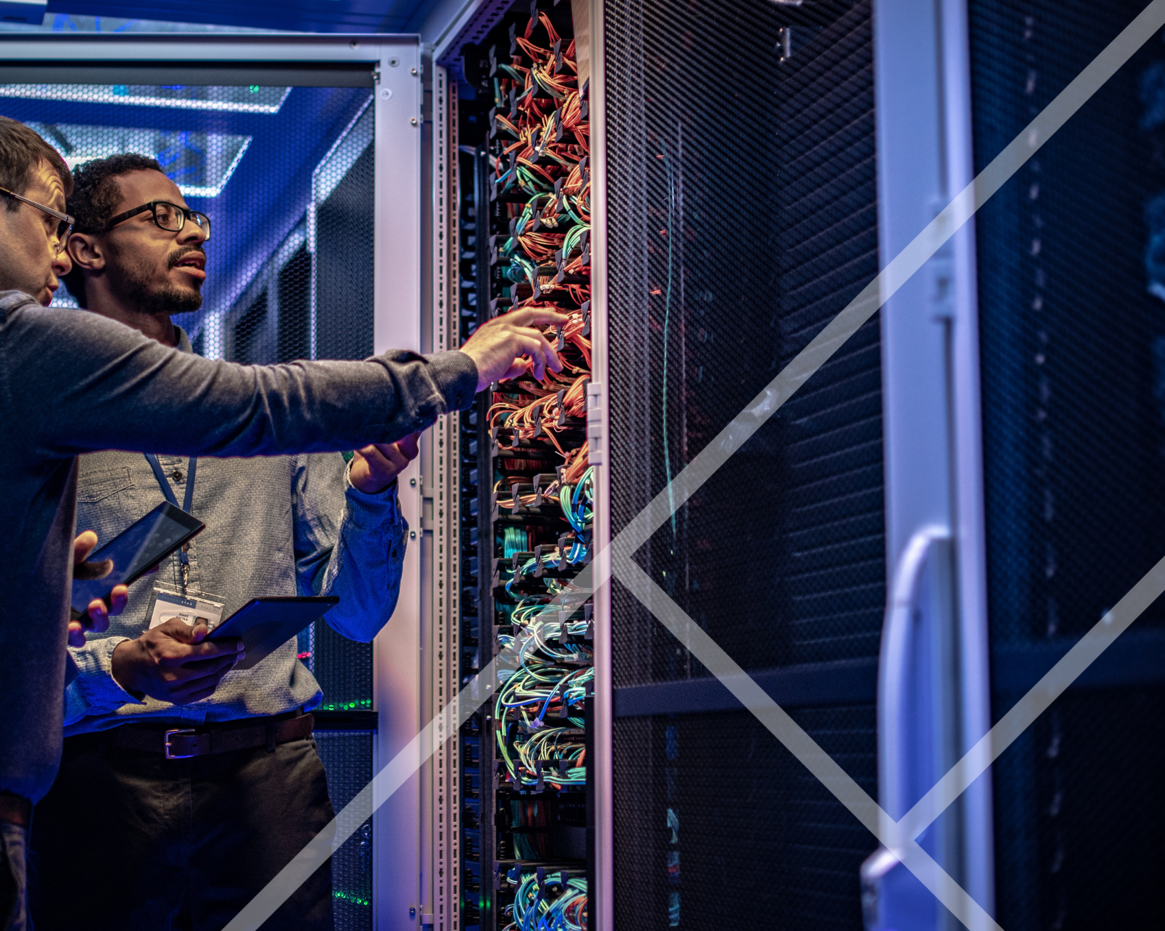 Two men standing next to servers - First Technology Datacentre and Cloud