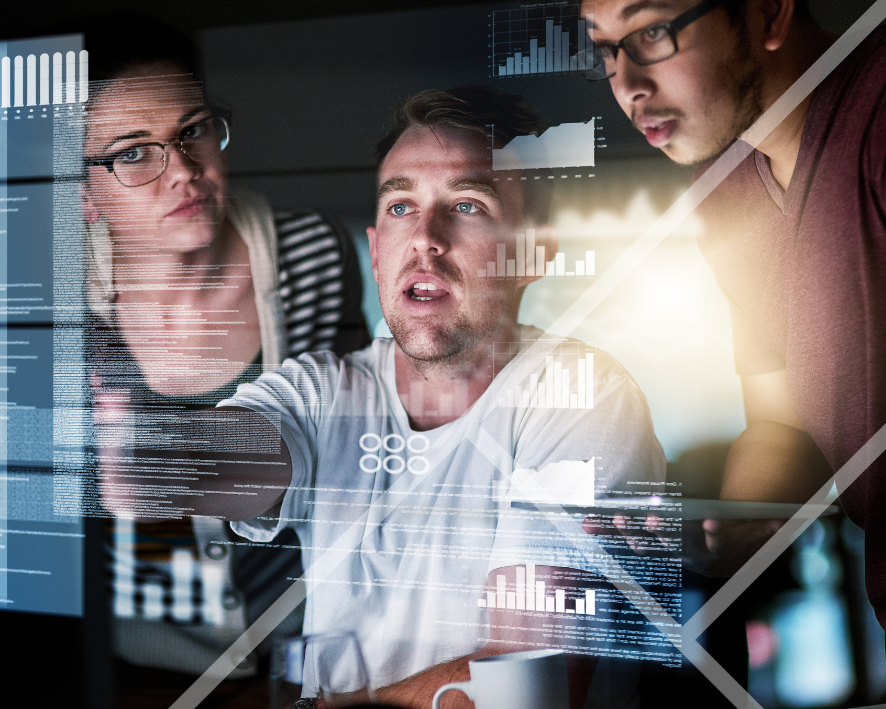 Three people working on a screen infront of them