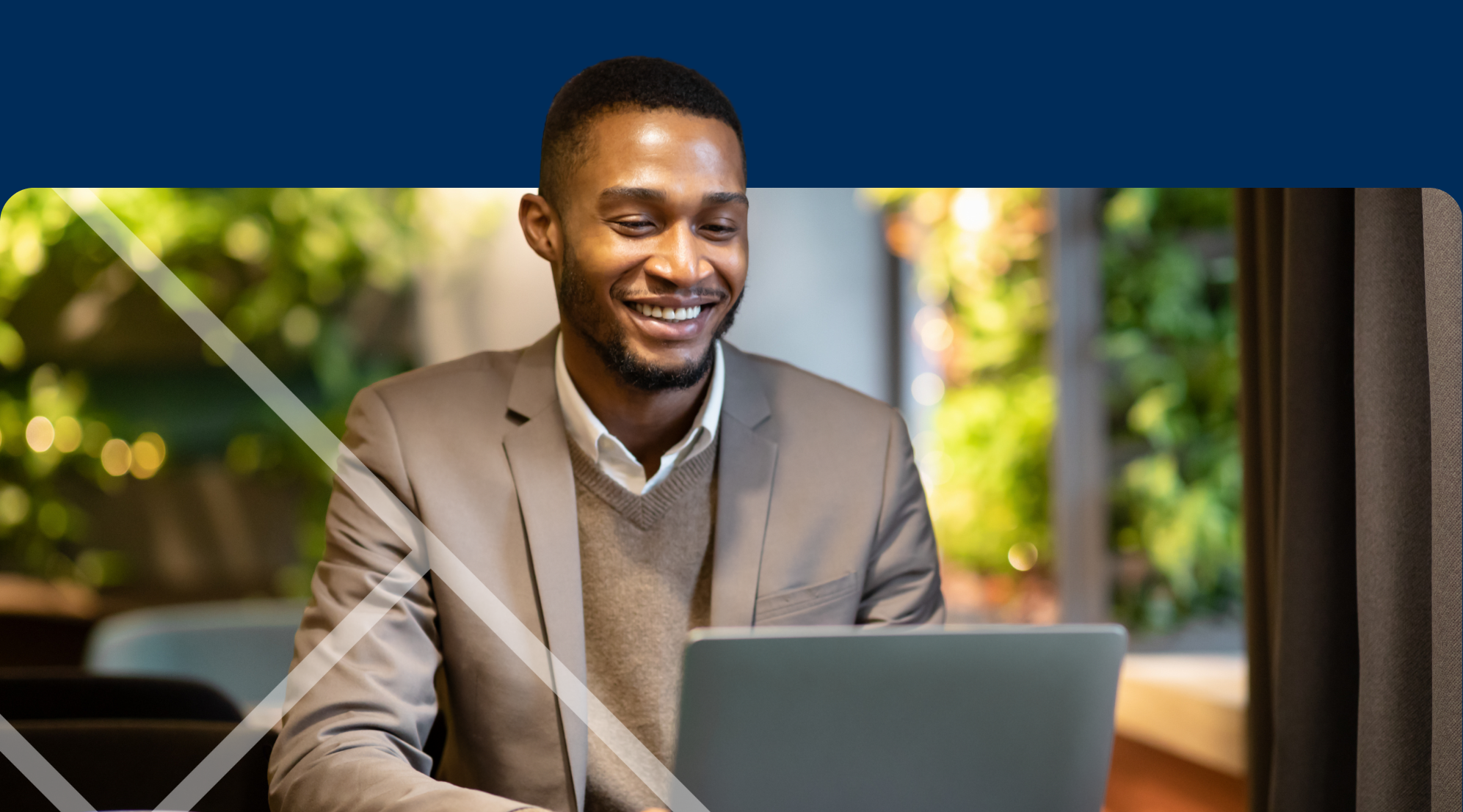 Man sitting at a laptop First Technology Cyber Security Solutions Workshops