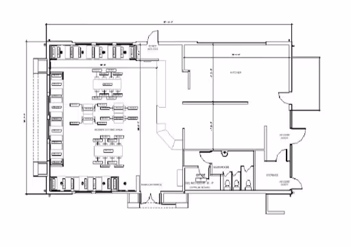 Architectural floor plan showing kitchen, seating area, restrooms, storage, and entrances with dimensions.