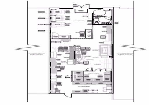 Floor plan of a building with labeled rooms, doors, windows, and furniture layout.