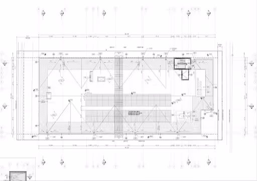 Architectural blueprint of a building roof plan with measurements and structural details.