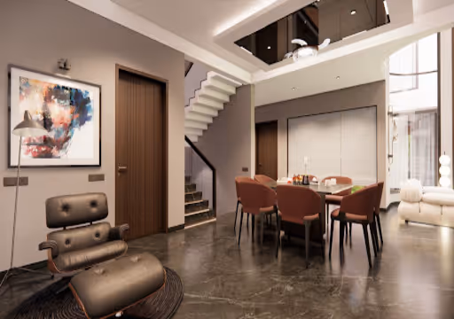 Modern living room with brown leather chair, dining table with chairs, abstract wall art, and staircase.
