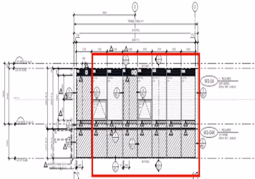 Architectural floor plan section with measurements and symbols highlighted by a red square.