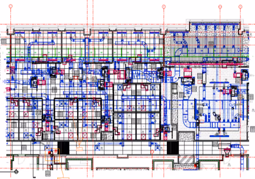 Complex architectural floor plan with detailed HVAC and electrical system layouts in blue, red, and black lines.