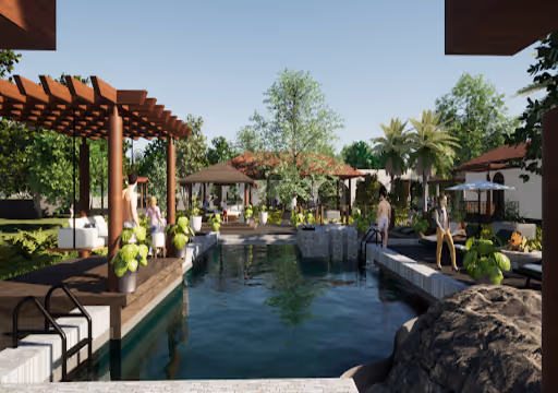 Outdoor pool area with people, lush greenery, pergola, and seating spaces under clear blue sky.
